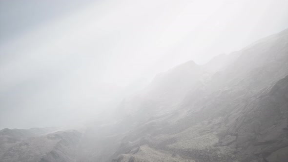 Sun Rays Against the Backdrop of the Mountains