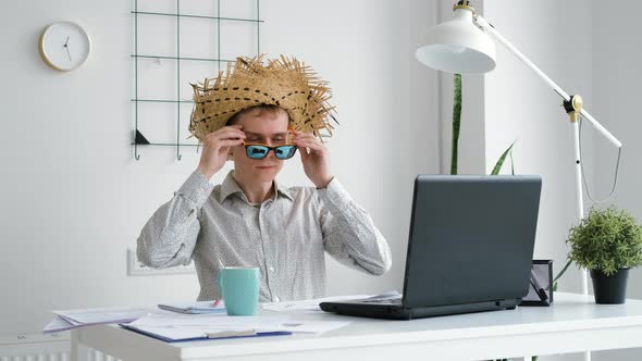 Male Office Worker Ready to Leave for Vacations