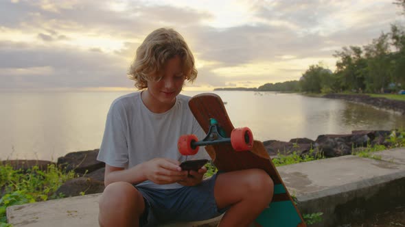 A Teenager Sitting is Chatting in Social Networks