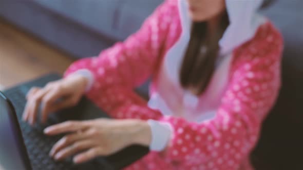 Young Woman in Funny Pajama Working From Home