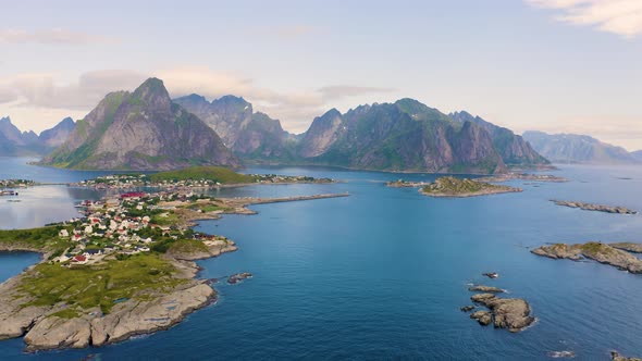 Flying Above Reine Fishing Village with Mountains and Fjords on Lofoten Islands