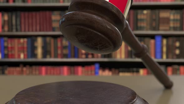 Flag of Malta on Falling Judges Gavel in Court