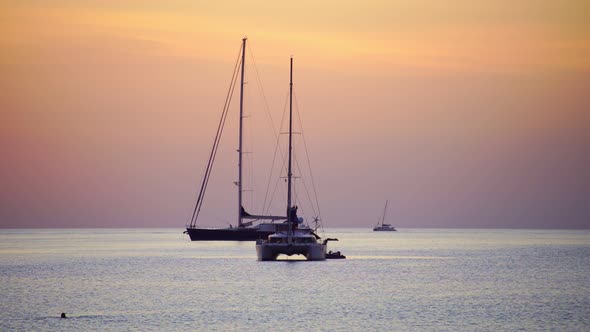 Sail boat in tropical sea at beautiful sunset or sunrise sky