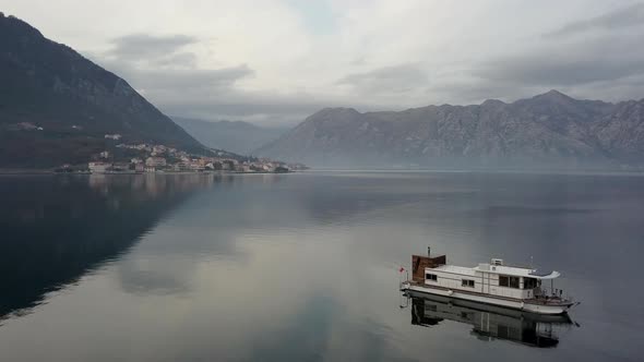 Aerial view of floating house in Boko-Kotorskaya Bay in Montenegro