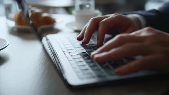 Businessman Hands Working Laptop Typing Computer Keyboard in Cafe Coworking