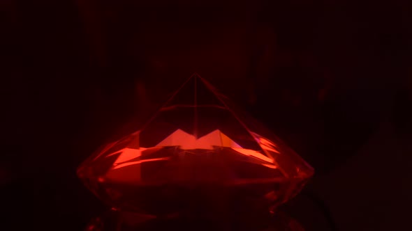 Bright Red Color Turning Into a Blue Sparkling Diamond