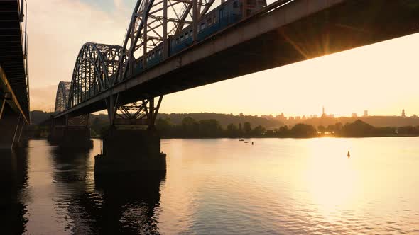 Train Moving on the Bridge Over the River