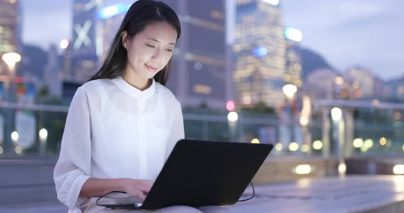 Young Businesswoman work on notebook computer at night