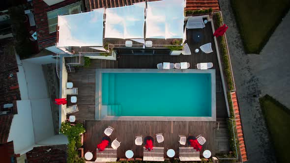 Rooftop Pool on Urban City Building - Aerial Overhead View