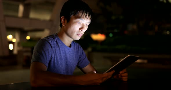 Young man looking at tablet computer