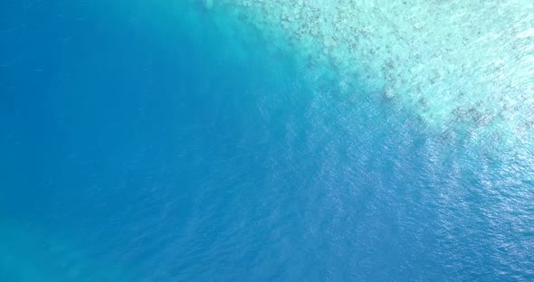 Natural drone abstract view of a sandy white paradise beach and aqua blue water background in hi res