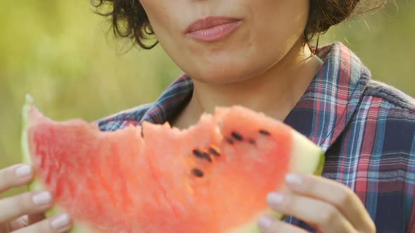 Young Woman Eating Juicy Watermelon on Summer Picnic and Smiling, Vitamins