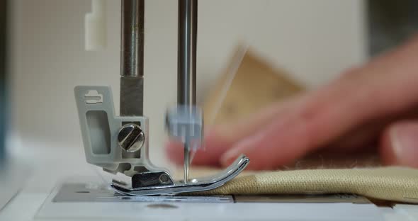 Dressmaker Working on Sewing Machine Closeup