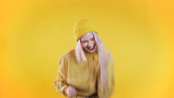 Punk Girl with Pink Hair Very Glad and Happy, She Shows Yes Gesture of Victory