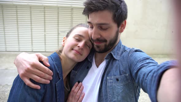 Affectionate couple posing for a selfie