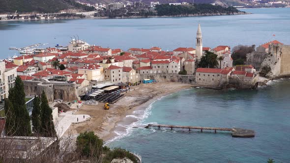 Snow on the Tops of the Mountains Over the Old Part of the Town of Budva