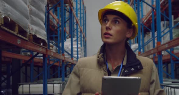 Young female worker in a warehouse