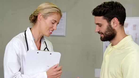 Physiotherapist shaking hands with patient