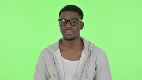 African Man Talking on Online Video Chat on Green Background