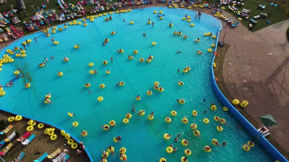 Crowd of people relaxes in the city open-air water park