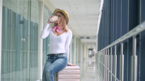 Woman Drink Coffee Inside Airport