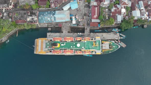 Aerial: flying over passenger ship Pelni in Bandaneira harbor Indonesia