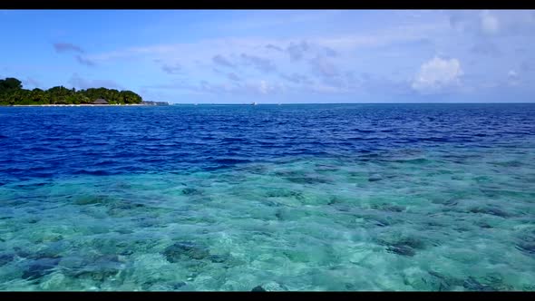 Aerial landscape of perfect coastline beach vacation by shallow sea with white sandy background of a