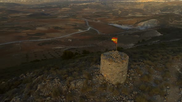 Circling an Old Abandoned Lookout Tower with a Spanish Flag