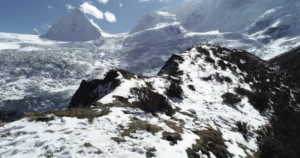 Drone flying over winter nature with fossil glacier and snow mountians