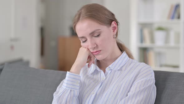 Portrait of Tired Young Woman Taking Nap 