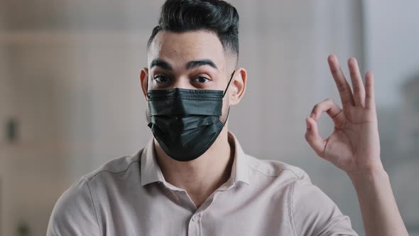 Happy Hispanic Male Employee Arabian Man Entrepreneur Wear Medical Mask Prevent Coronavirus Epidemic