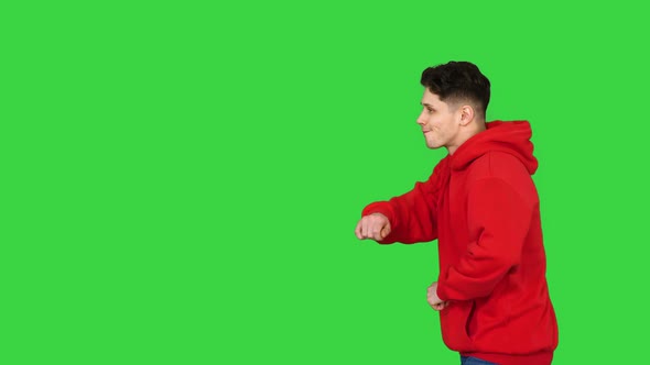 Trendy Dancer Man Walking and Dancing on a Green Screen, Chroma Key.