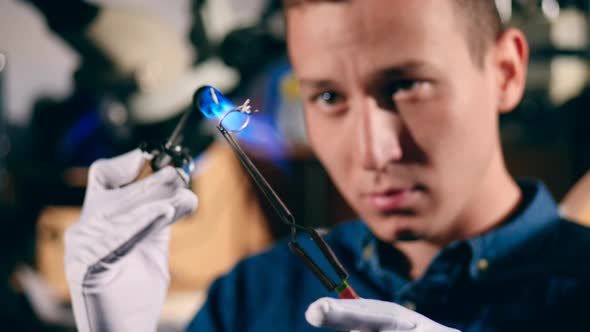 Goldsmith Is Burning a Silver Ring's Frame