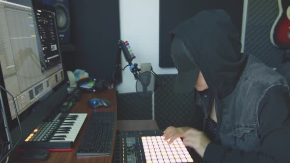 Slow Motion of Female Producer Working with Audio Controller