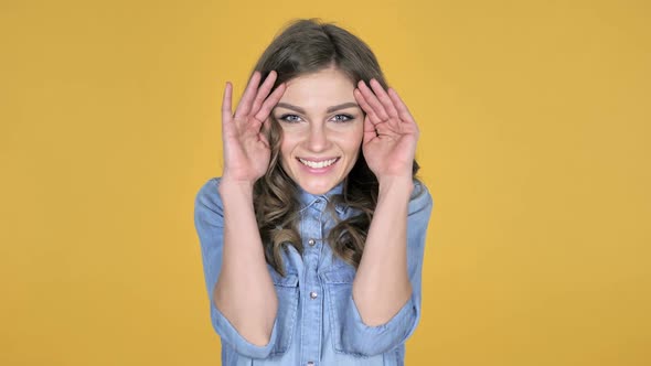 Hide and SeekSmiling Young Girl Hiding Her Face with Hands