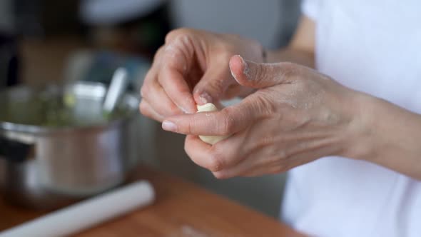 Housewife Sculpts Pies in the Kitchen