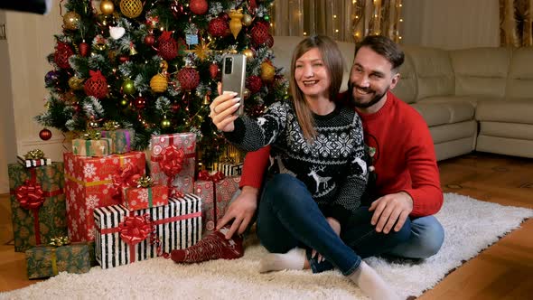 Young Multiethnic Couple Making Videocall Xmas