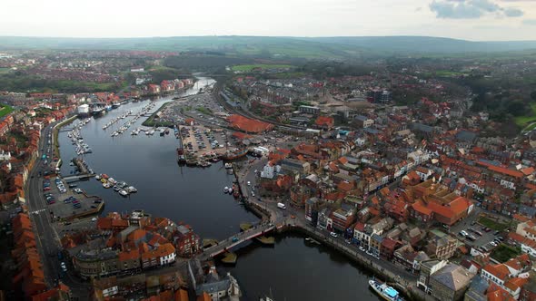 Aerial View Of Whitby Seaside Town With River Esk And Harbor In Yorkshire, Northern England.