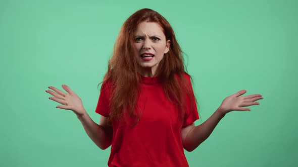 Furious Woman on Green Background