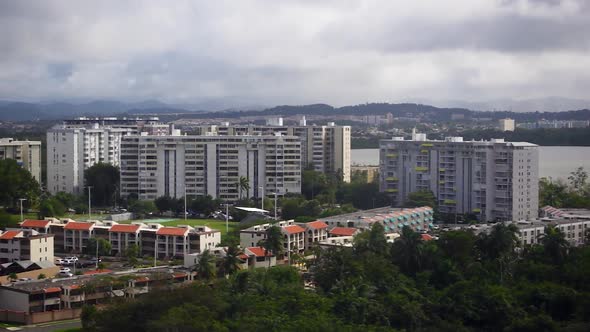 Aerial Tracking View of San Juan Puerto Rico Housing on Overcast January Day