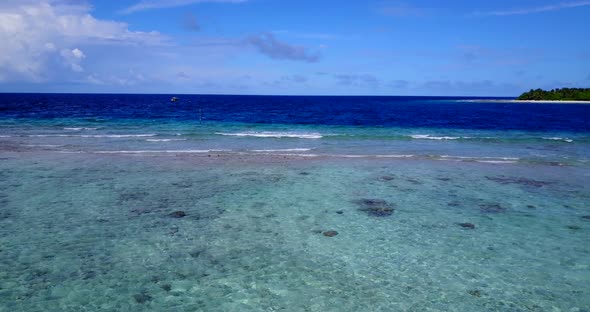 Beautiful aerial abstract shot of a sandy white paradise beach and aqua turquoise water background i