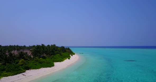 Natural aerial clean view of a white sand paradise beach and aqua turquoise water background 