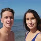 Summer Vacation in Coronavirus Epidemic. Couple on Beach with Sunburn in Shape of Face Mask. - VideoHive Item for Sale