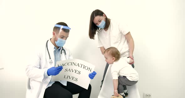 Baby Boy with Mother Visiting Doctor for Vaccine