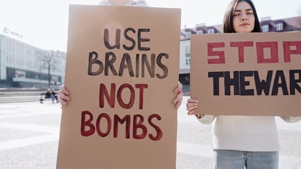 Young People Stand on the Street with Posters Calling to Stop the War