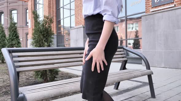 Woman Coming and Sitting on Bench During Break in Office