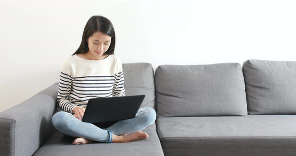 Woman use of notebook computer at home