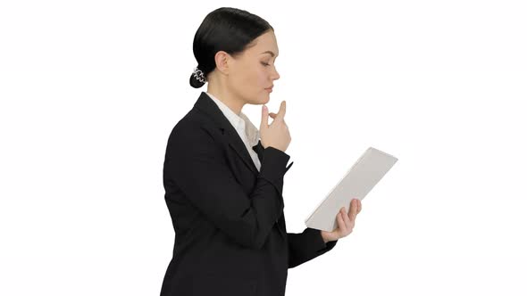Businesswoman Using a Tablet Pad While Walking on White Background