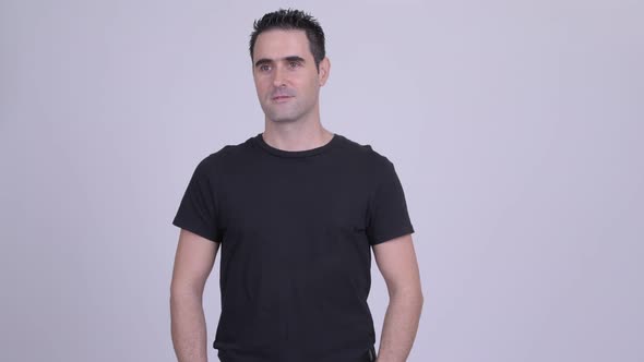 Handsome Man Thinking While Looking Awayagainst White Background