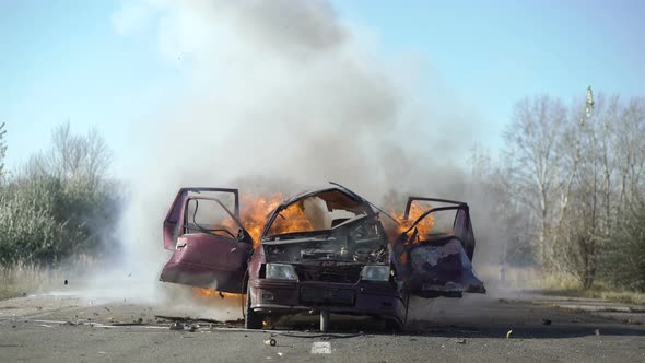 Car Explosion On The Road. Car burning.
